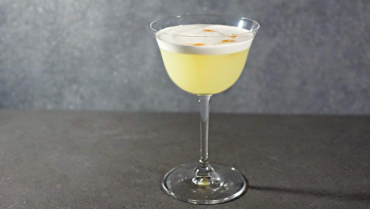 Gin Sour cocktail in Sour Glass with Bitters and egg white