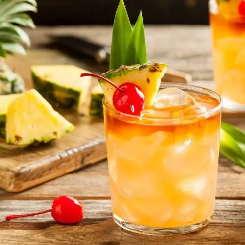Mai Tai Cocktail on table garnished with pineapple