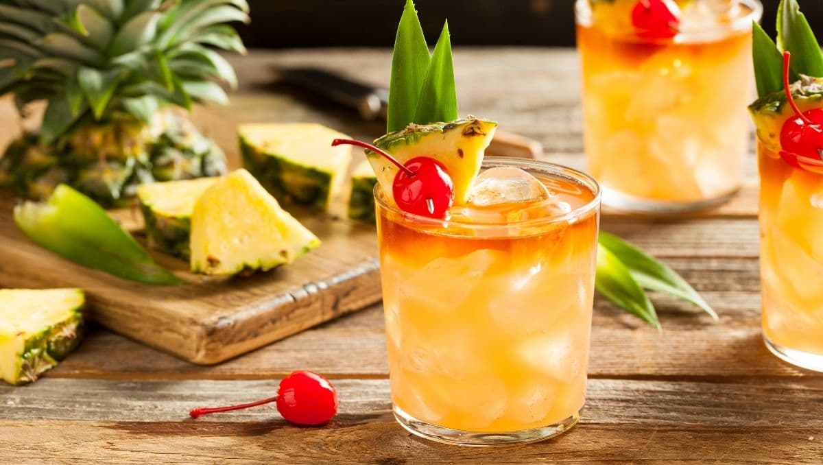 Mai Tai Cocktail on table garnished with pineapple