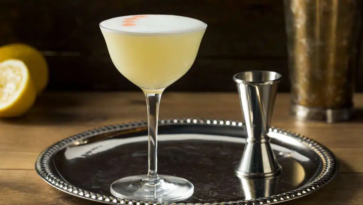 Pisco Sour Cocktail with Angostura Bitters on silver tablet