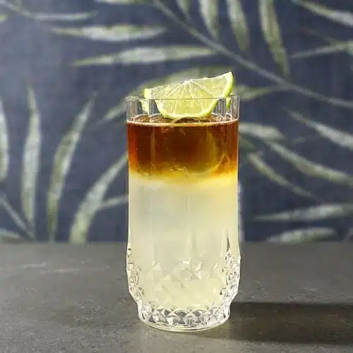 Dark 'n' Stormy cocktail with lime