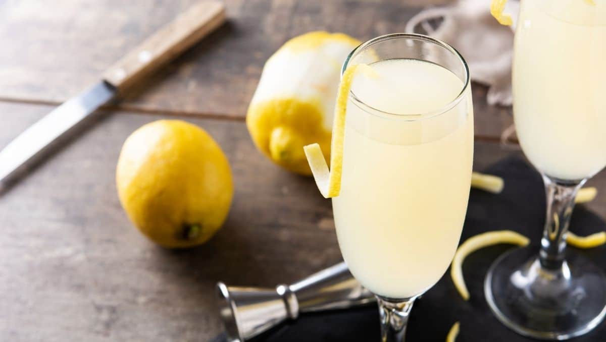 French 75 cocktail in Champagne flutes with garnish