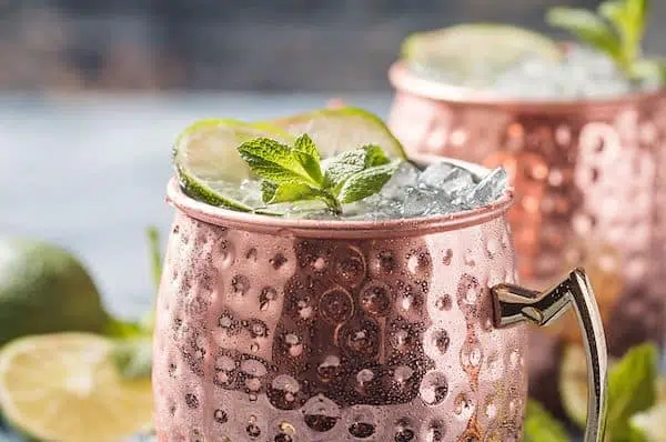 Moscow Mule Cocktails garnished with mint and lime