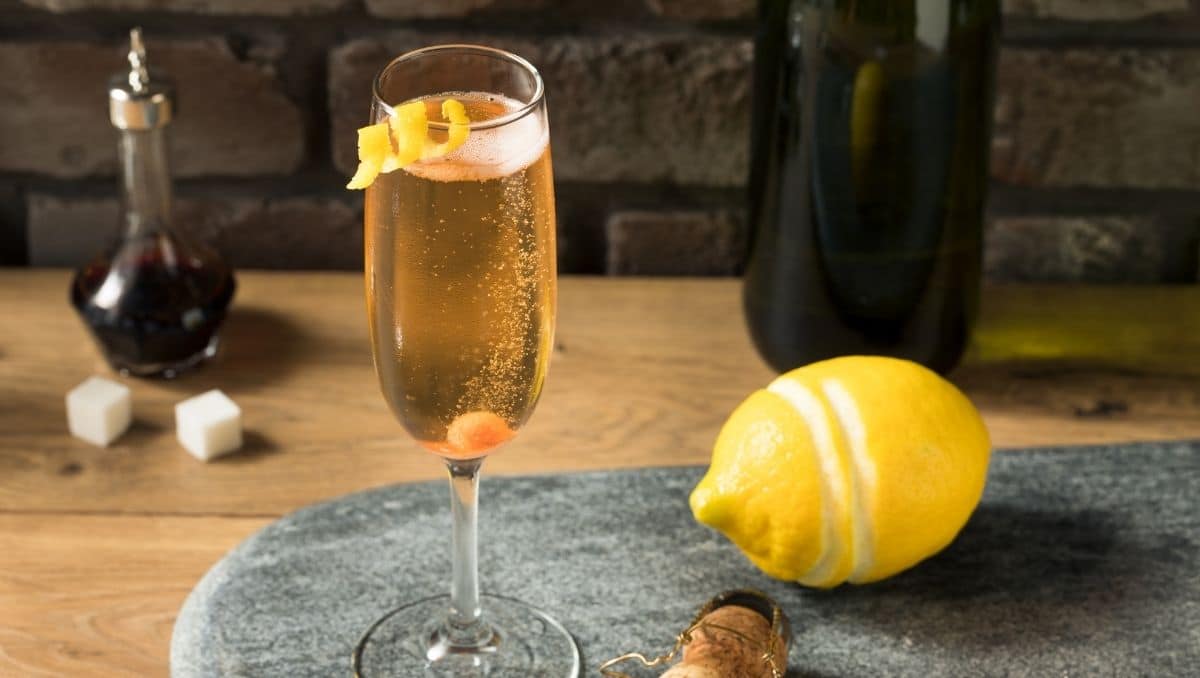 Champagne cocktail with lemon peel garnish