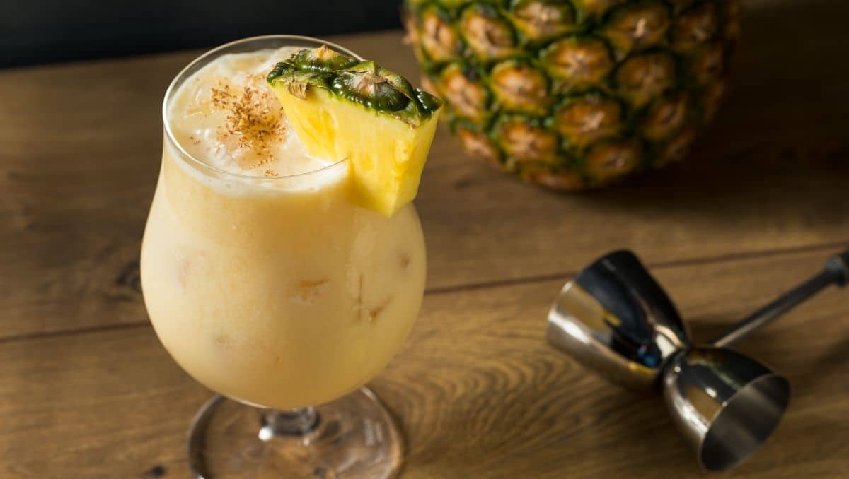 Painkiller cocktail with pineapple garnish