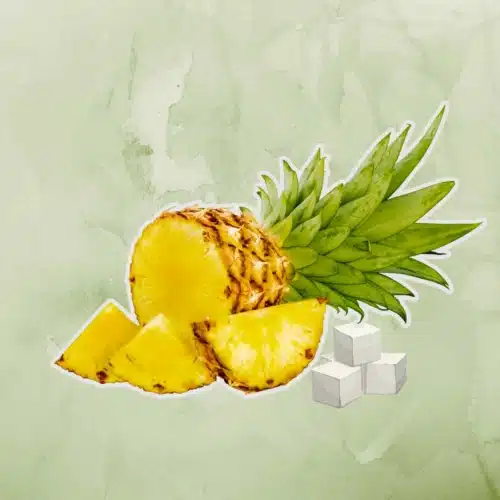 Ripe Pineapple and sugar used to make pineapple syrup on green background