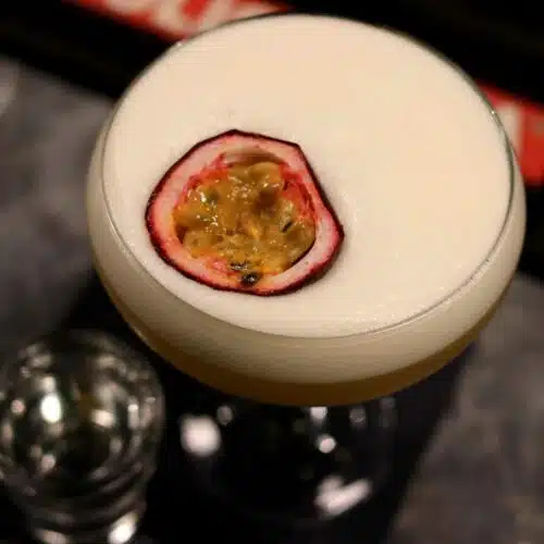 Pornstar Martini from top - garnished with passion fruit and Prosecco shot on the side
