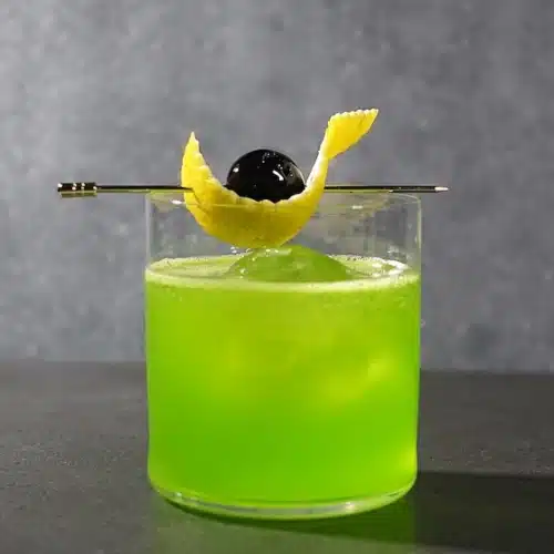 Midori Sour cocktail with cherry