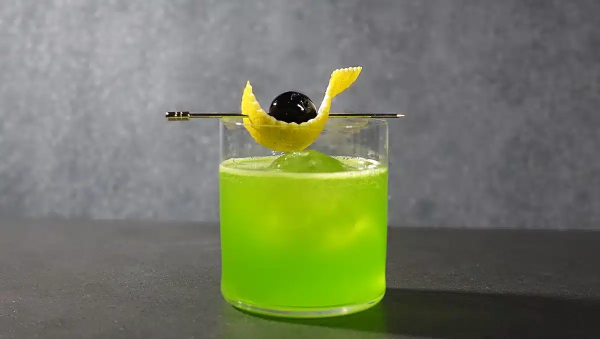 Midori Sour cocktail with cherry