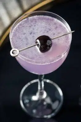Aviation Cocktail with maraschino cherry garnish