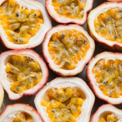 Fresh passion fruits halves on table