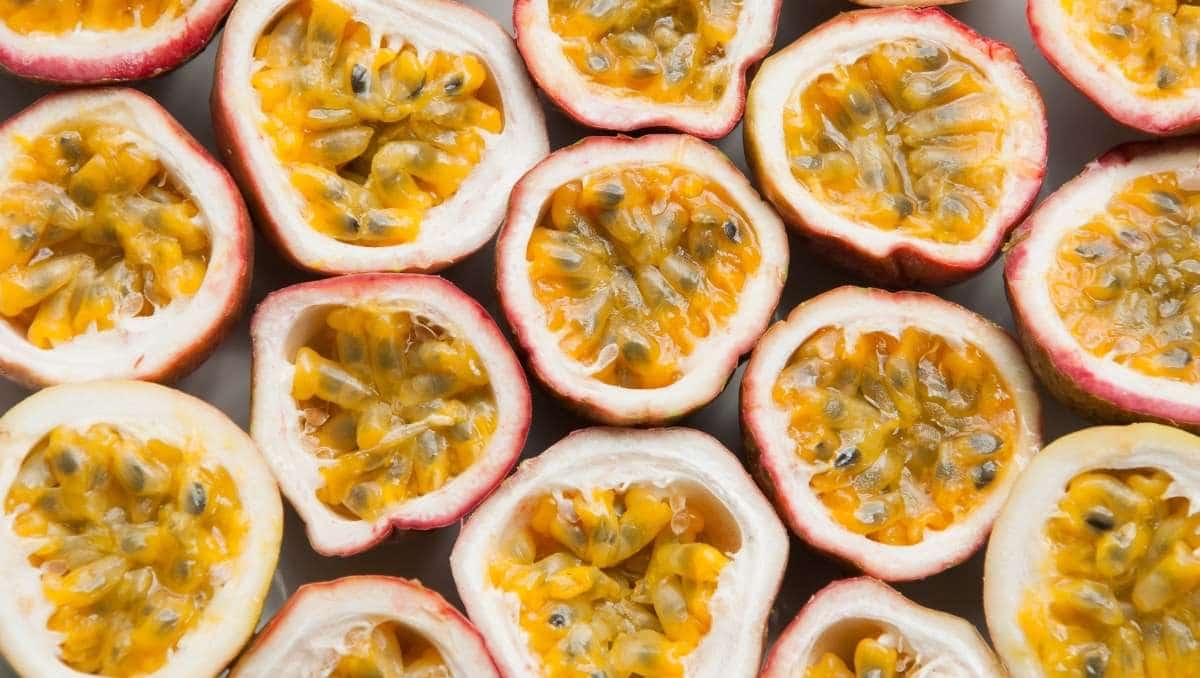 Fresh passion fruits halves on table