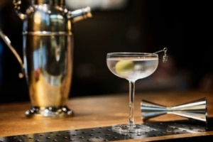 Smoky Martini cocktail with olive garnish