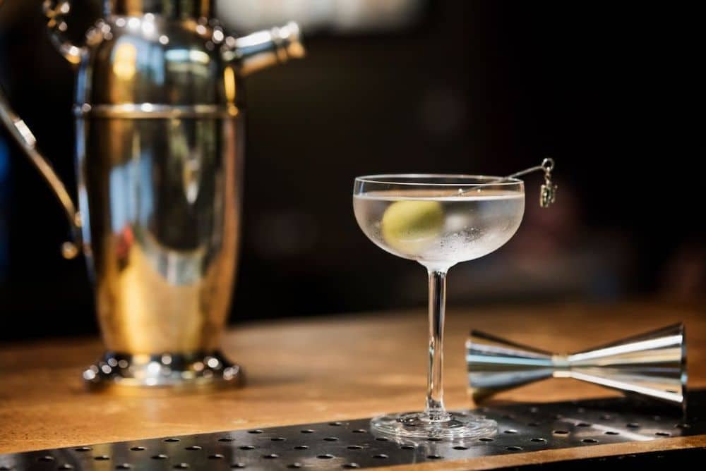 Smoky Martini cocktail with olive garnish