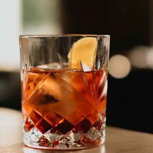 Aperol Negroni with citrus peel on table