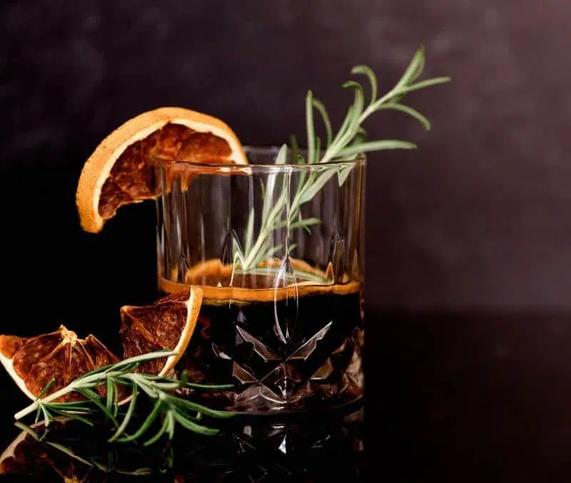 Tuaca liqueur served chilled with orange and rosemary