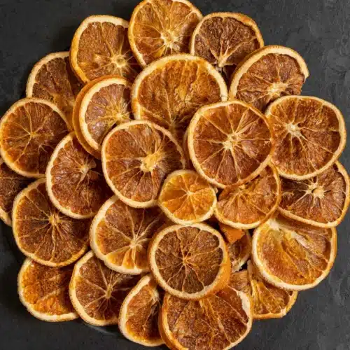 Collection of Orange slices dried in oven arranged in circular shape