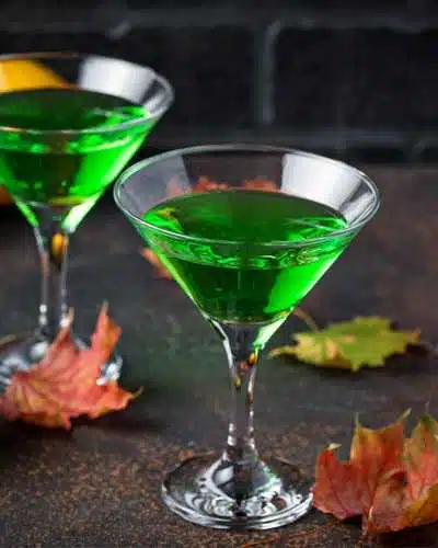 Minty Emerald Isle cocktail next to leaves