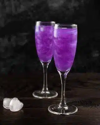 Empress French 75 cocktail on dark background