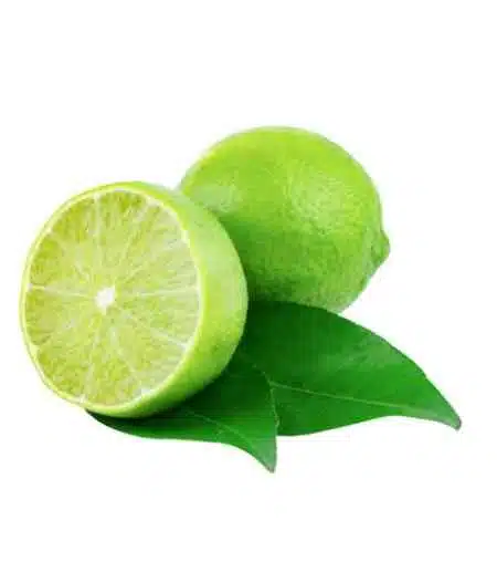 fresh limes with leaves on white background